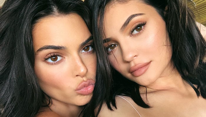 Kylie Jenner pulls Kendall Jenners leg on 28th birthday