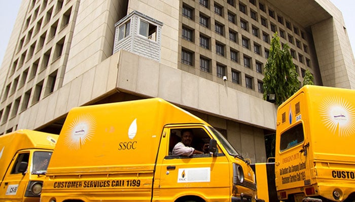 A view of SSGC vans standing outside its headquarters in Karachi. — SSGC