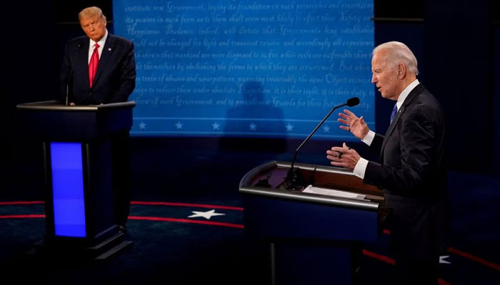 Democratic presidential candidate former Vice President Joe Biden answers a question as President Donald Trump listens during the second and final presidential debate at the Curb Event Center at Belmont University in Nashville, Tennessee, US, October 22, 2020.—Reuters