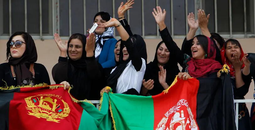Afghan women waving their countrys flag. — Reuters/File