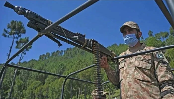 A Pakistani soldier patrols near Line of Control at Salohi village in Poonch district of Azad Jammu and Kashmir on April 26, 2021. — AFP