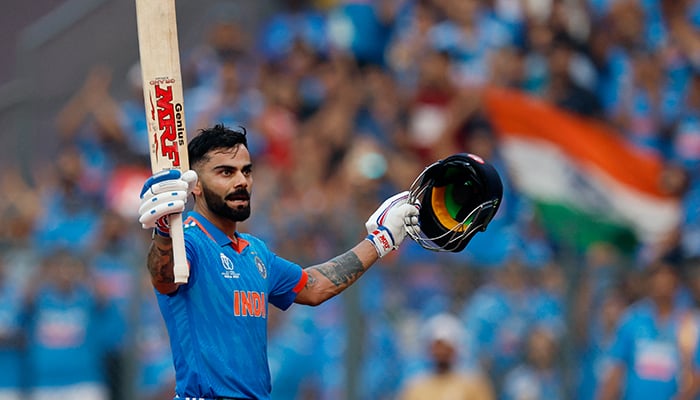 Indias Virat Kohli acknowledges the crowd and walks back to the pavilion after losing his wicket, caught out by New Zealands Devon Conway off the bowling of Tim Southee. — Reuters