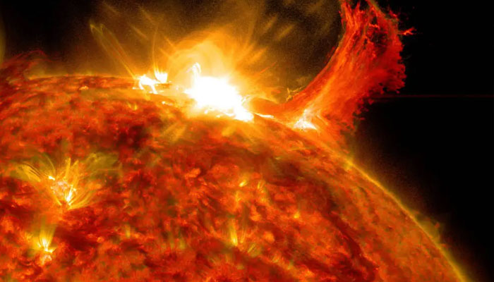 NASA’s Solar Dynamics Observatory captured this image of a solar flare on Oct. 2, 2014. The solar flare is the bright flash of light at the top.—NASA
