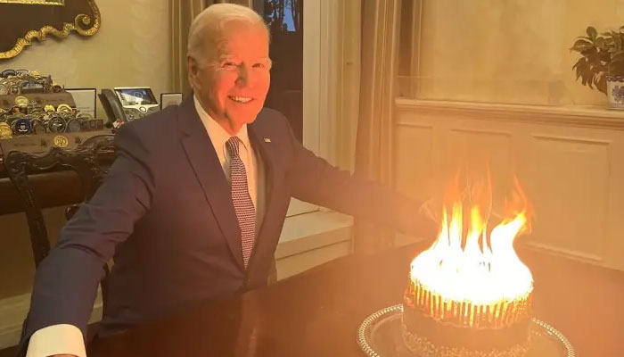 A photo of President Biden in front of a blazing birthday cake has inspired a string of jokes online.—NYPost