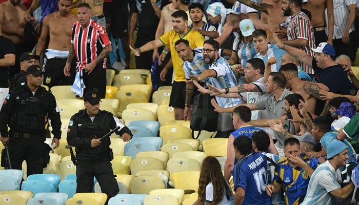 Brazilian police clash with fans of Argentina before the start of the 2026 FIFA World Cup South American qualification football match between Brazil and Argentina at Maracana Stadium in Rio de Janeiro, Brazil, on November 21, 2023. — AFP