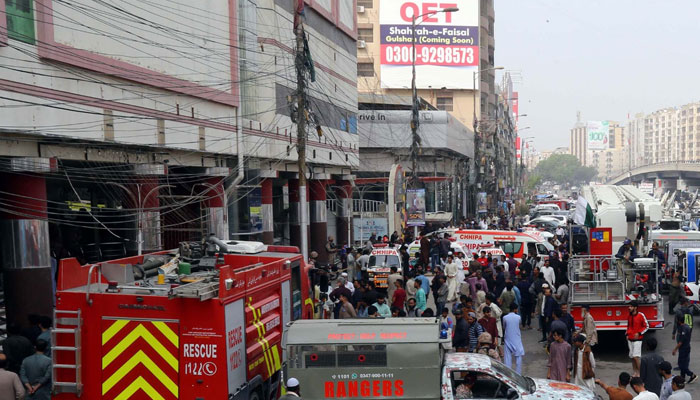 View of the site after a massive fire engulfed a multi-storey shopping mall while rescue operation is underway, at Rashid Minhas road in Karachi on Saturday, November 25. — PPI