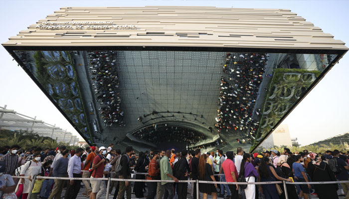 Visitors queue outside the Saudi Pavilion on the last day of Expo 2020, in Dubai, on March 31, 2022. — AFP