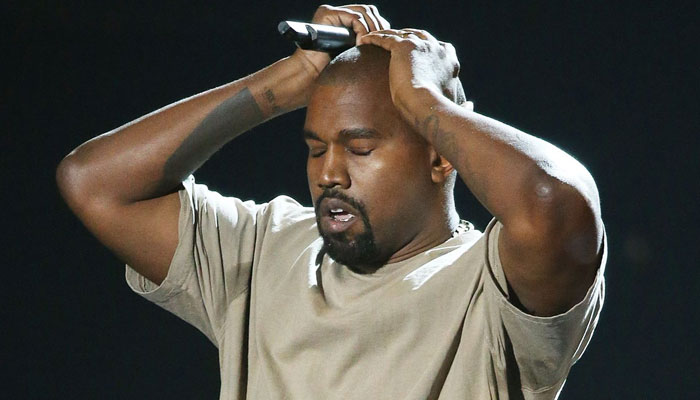 Kanye West falls to the ground on Spotify charts