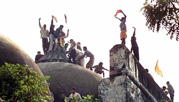 Members of the Hindu mob demolishing the Ayodhyas Babri Masjid. — AFP/File
