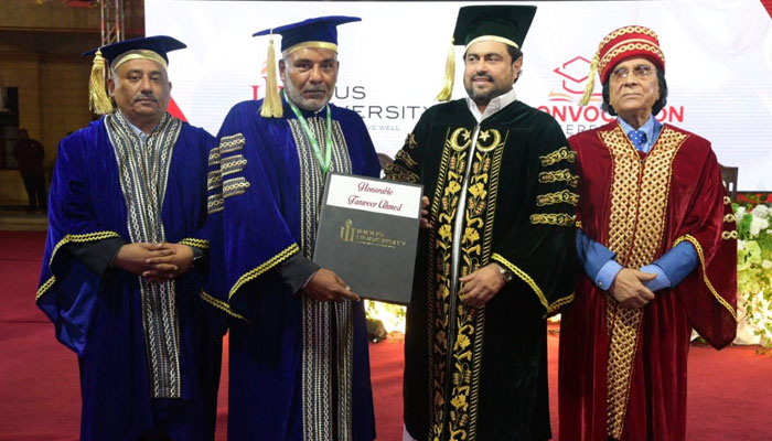 Sindh Governor Kamran Tessori (right) confers doctorate degree and a gold medal on Houston-based Pakistani-American businessman Tanweer Ahmed (left). — Provided by the reporter