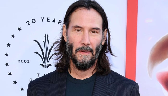 Keanu Reeves rocks on in Toronto after home burglary setback