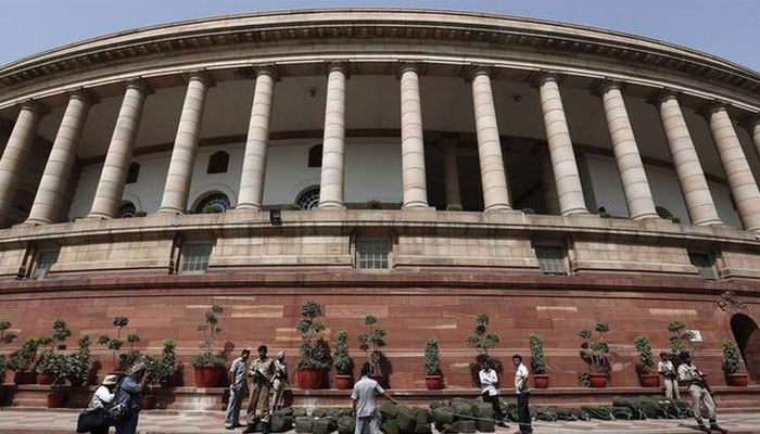 Security personnel stand guard at parliament in New Delhi July 10, 2014. — Reuters