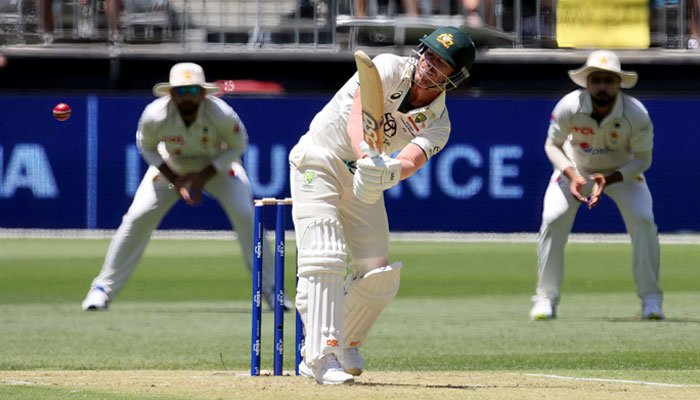 Australias David Warner plays a shot during the first day of the first Test cricket match between Australia and Pakistan at Optus Stadium in Perth on December 14, 2023. — AFP