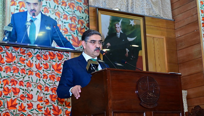 Caretaker Prime Minister Anwaar-ul-Haq Kakar addressing the Azad Jammu and Kashmir Legislative Assembly in Muzaffarabad, on December 14, 2023. — PID