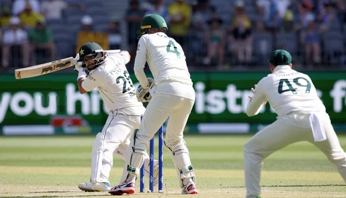 Imam-ul-Haq (L) plays a shot bowled by Australia´s Nathan Lyon during the second day of the first Test cricket match between Australia and Pakistan in Perth on December 15, 2023. - AFP