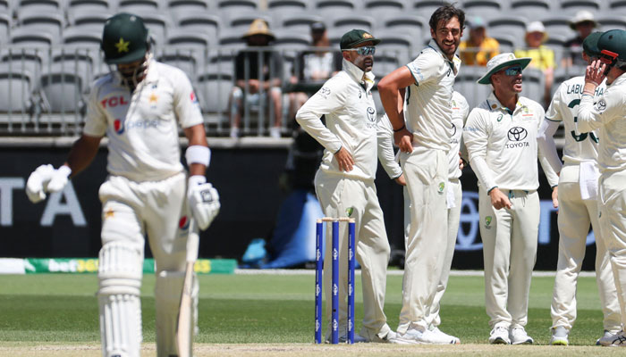 Australia’s Mitchell Starc (3rd R) reacts after taking the wicket of Pakistan’s Abdullah Shafique (L) on day four of the first Test cricket match between Australia and Pakistan in Perth on December 17, 2023. — AFP