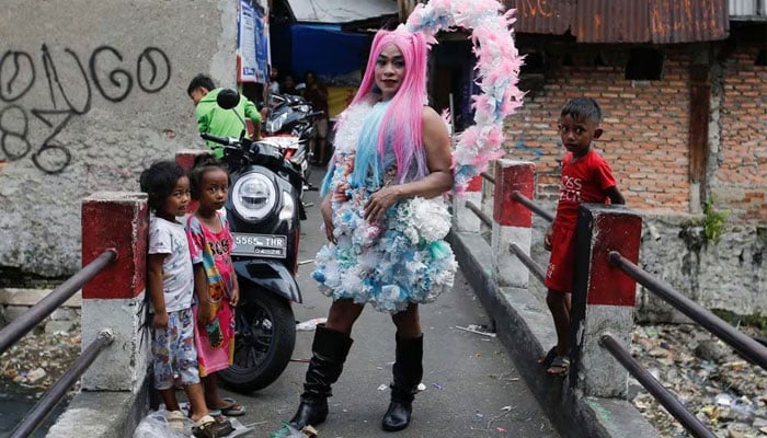 Agustina, 41, a trans woman poses before a Trans Super Heroes fashion show at a traditional market in Jakarta, Indonesia, December 17, 2023. —Reuters