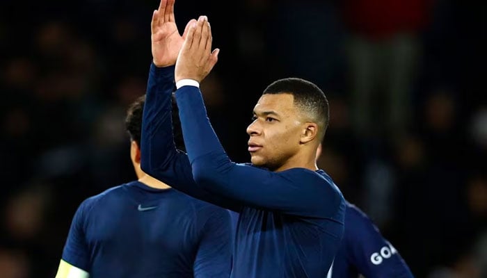 Paris St Germains Kylian Mbappe applauds fans after the match. — REUTERS