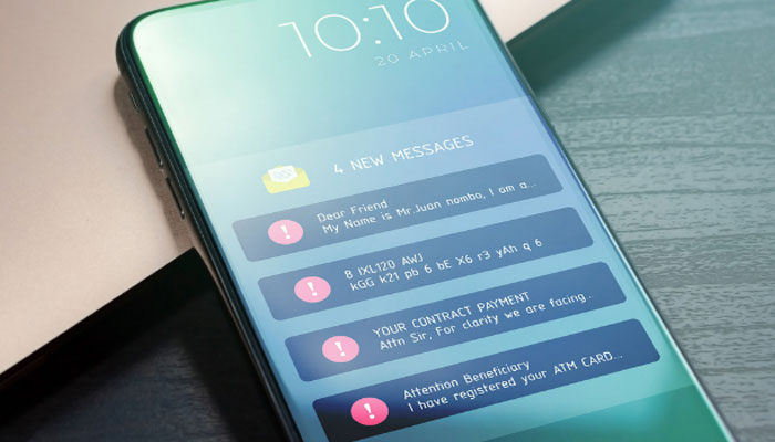 A representational image of a smartphone displaying scam messages. — Canva