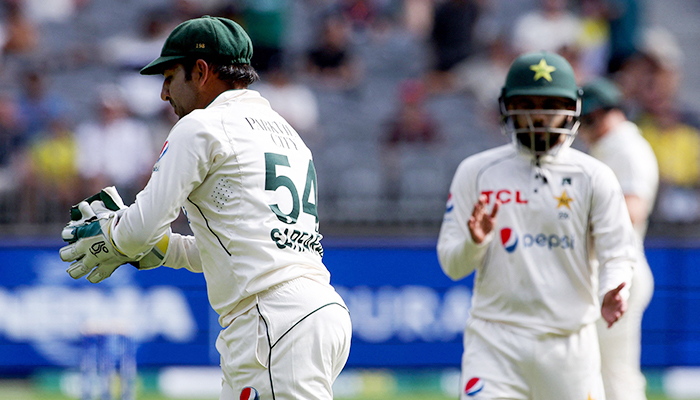 Pakistans Sarfaraz Ahmed catches Australias Marnus Labuschagne shot during day three of the first Test cricket match between Australia and Pakistan in Perth on December 16, 2023. — AFP