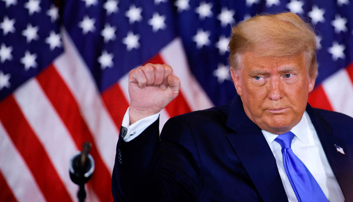 US President Donald Trump raises his fist as he reacts to early results from the 2020 U.S. presidential election in the East Room of the White House in Washington, US, November 4, 2020.—Reuters