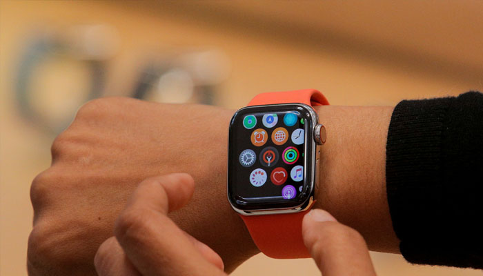 An Apple Store employee shows the Series 5 Apple Watch during the preview of the redesigned and reimagined Apple Fifth Avenue store in New York, US, September 19, 2019.—Reuters