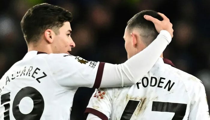 Phil Foden (right) and Julian Alvarez were both on the scoresheet for Manchester City against Everton. — AFP