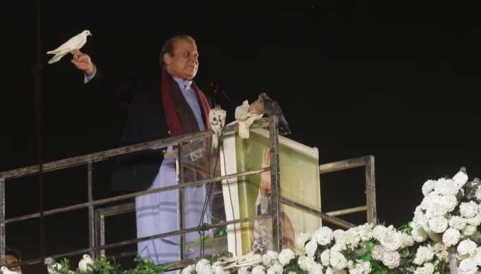 Former Prime Minister Nawaz Sharif prepares to release a pigeon in front of supporters, following his arrival from a self-imposed exile in London, ahead of the 2024 Pakistani general election, in Lahore, Pakistan, October 21, 2023. — Reuters