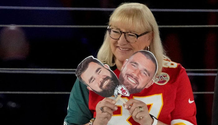 Donna Kelce poses with head cut-outs of her sons Philadelphia Eagles centre Jason Kelce (62), left, and Kansas City Chiefs tight end Travis Kelce (87) during Super Bowl Opening Night at Footprint Center on February 6, 2023, in Phoenix, Arizona, US. — Reuters