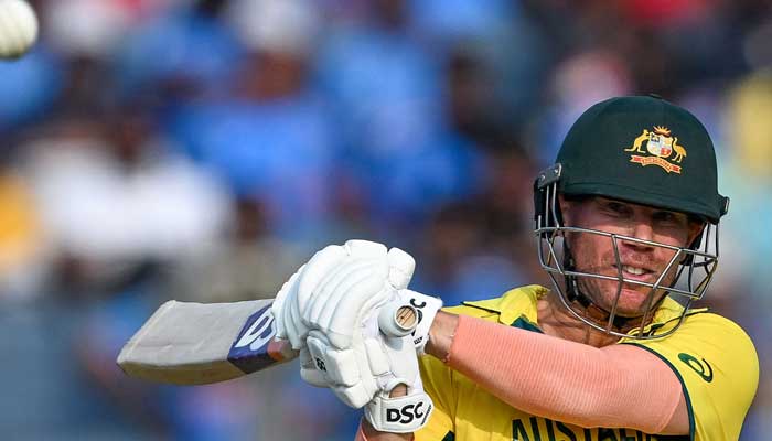 Australia´s David Warner plays a shot during the 2023 ICC Men´s Cricket World Cup one-day international (ODI) match between Australia and Bangladesh at the Maharashtra Cricket Association Stadium in Pune on November 11, 2023. — AFP