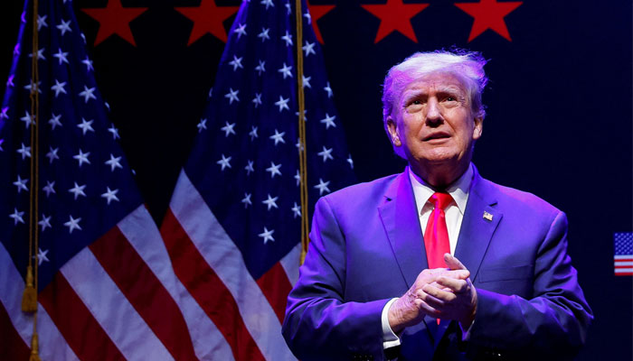 Former US President Donald Trump takes the stage to deliver remarks on education as he holds a campaign rally with supporters, in Davenport, Iowa, U.S. March 13, 2023. - Reuters