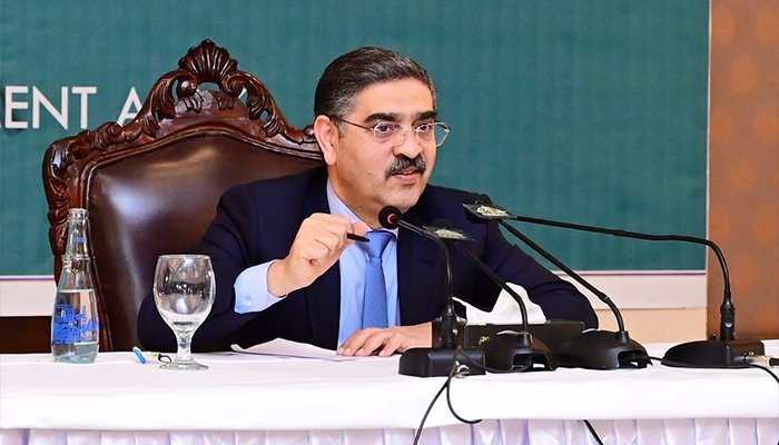 Caretaker Prime Minister Anwaar-ul-Haq Kakar interacting with the Beaconhouse National University students in Lahore on January 2, 2024. — APP