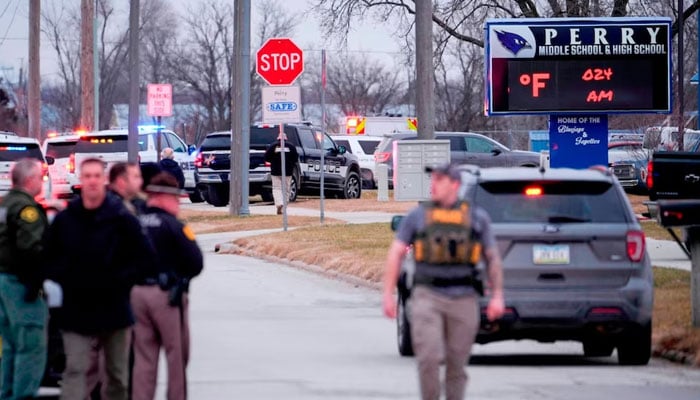 Law enforcement officers work at the scene of a shooting at Perry High School in Perry, Iowa, January 4, 2024..-Reuters