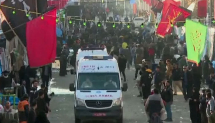 Ambulances leave the site of the explosion near the grave of Iranian general Qasem Soleimani in southern Iran, on January 3, 2024, in this still taken from a video. — AFP