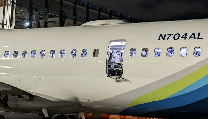 Alaska Airlines Flight 1282 grounded at Portland International Airport on Friday, January 5, 2024, after a section of the plane blew out mid-flight. — KPTV via passenger