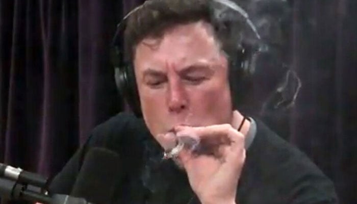 Musk smoking marijuana on the Joe Rogan Experience show, in 2018. —Joe Rogan Experience/YouTube
