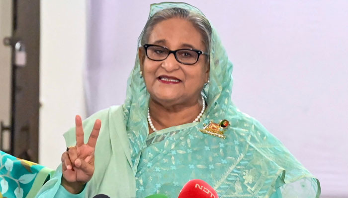 Bangladeshs Prime Minister Sheikh Hasina gestures after casting her vote casts at a polling station in Dhaka on January 7, 2024. — AFP