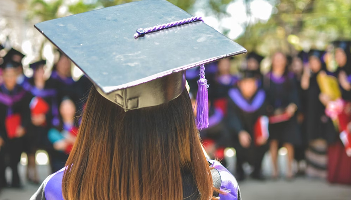 A student can be seen during a graduation ceremony. — Unsplash