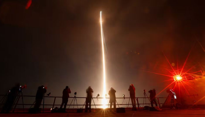 People take photographs during the launch of Boeing-Lockheed joint venture United Launch Alliances next-generation Vulcan rocket on its debut flight from Cape Canaveral, Florida, US January 8, 2024.—Reuters