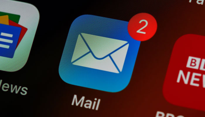 The Mail icon displayed on a phone screen. — Unsplash