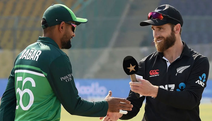 Pakistan former skipper Babar Azam (left) and Kane Williamson shake hands after the toss on January 9, 2023 in Karachi. — AFP