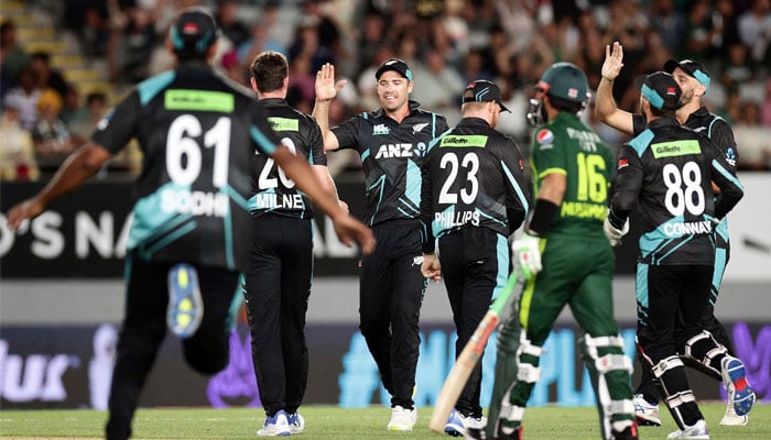 New Zealands players celebrate the wicket of Pakistans Saim Ayub during the first Twenty20 international cricket match between New Zealand and Pakistan at Eden Park in Auckland on January 12, 2024. — AFP