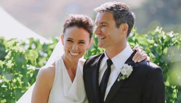 New Zealands former prime minister Jacinda Ardern poses with husband Clarke Gayford on after tying the knot on January 13, 2024. — New Zealand Herald via Felicity Jean Photography