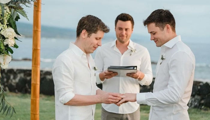 Sam Altman and Oliver Mulherin exchange wedding rings. — X/@heybarsee