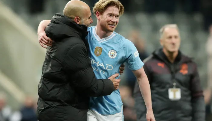 De Bruyne celebrates with Guardiola. — Reuters