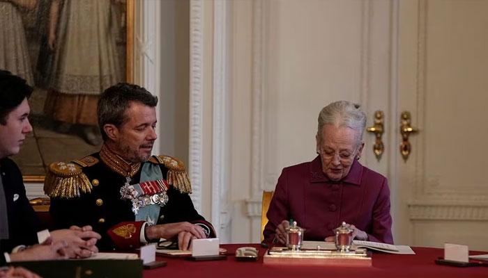 Queen Margaret of Denmark signs a declaration of abdication at the Council of State at Christiansborg Castle, after a 52-year reign, as eldest son Crown Prince Frederick ascends the throne as King Frederick X in Copenhagen, Denmark , January 14, 2024. Reuters
