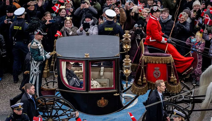 Queen Margaret of Denmark is escorted by the mounted squadron of the Hussar Guard Regiment in the golden carriage from Amalienborg Castle to Christiansborg Castle, on the day she abdicates after a 52-year reign and her eldest son, Crown Prince Frederick ascends the throne as King Frederick X. in Copenhagen, Denmark, on January 14, 2024. —Reuters