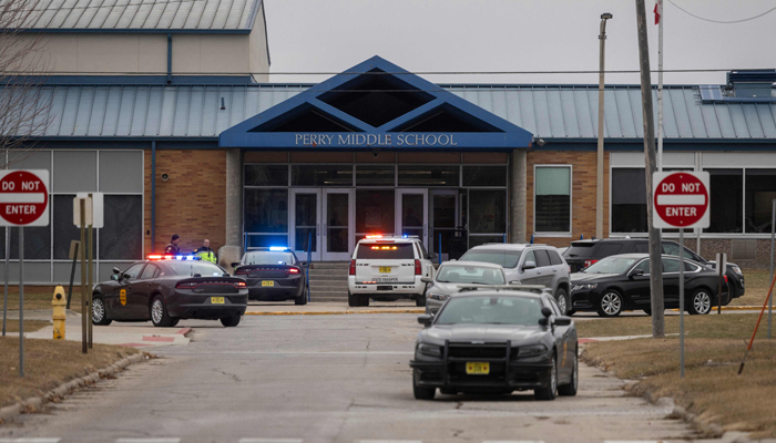 Police officers secure the campus at Perry Middle and High School during a shooting situation in Perry, Iowa, on January 4, 2024. — AFP