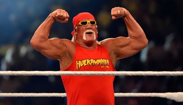 Hogan flexing his muscles in a fighting ring.—AFP/file