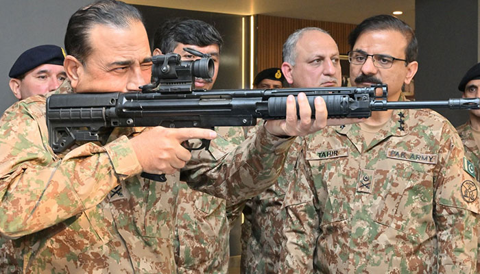 COAS General Asim Munir inspecting weapons during his visit to POF in Wah, Punjab, on January 16, 2024. — ISPR